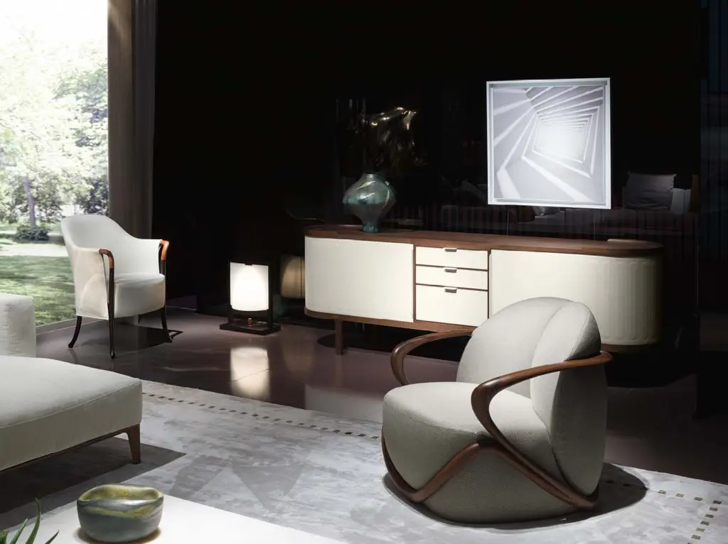 Living room with curved wood-armed lounge chair, credenza and abstract wall art