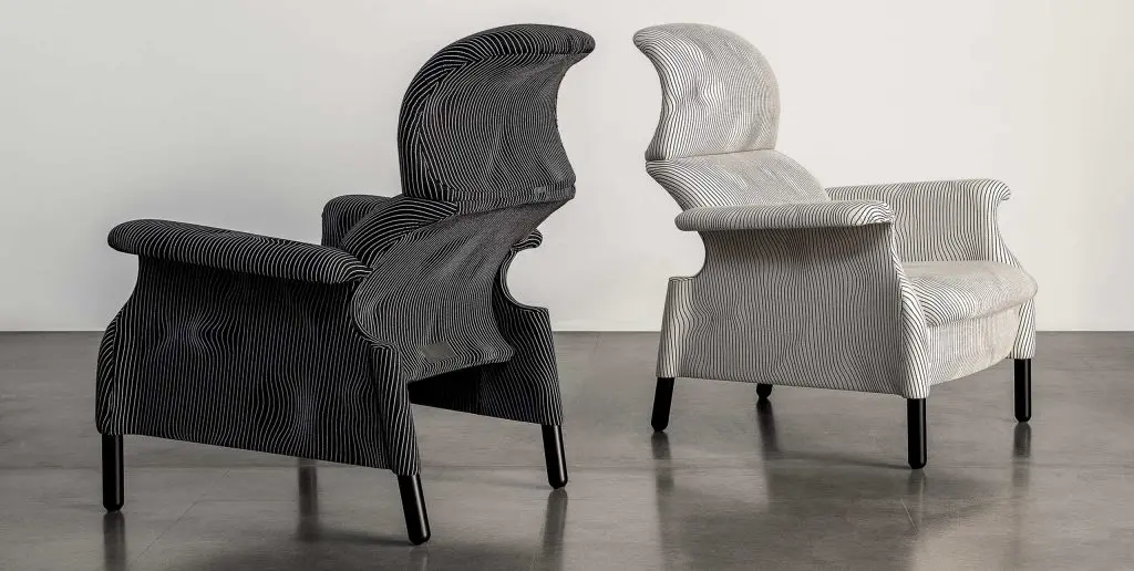 Two Sanluca-style curved-back armchairs in black and white striped upholstery