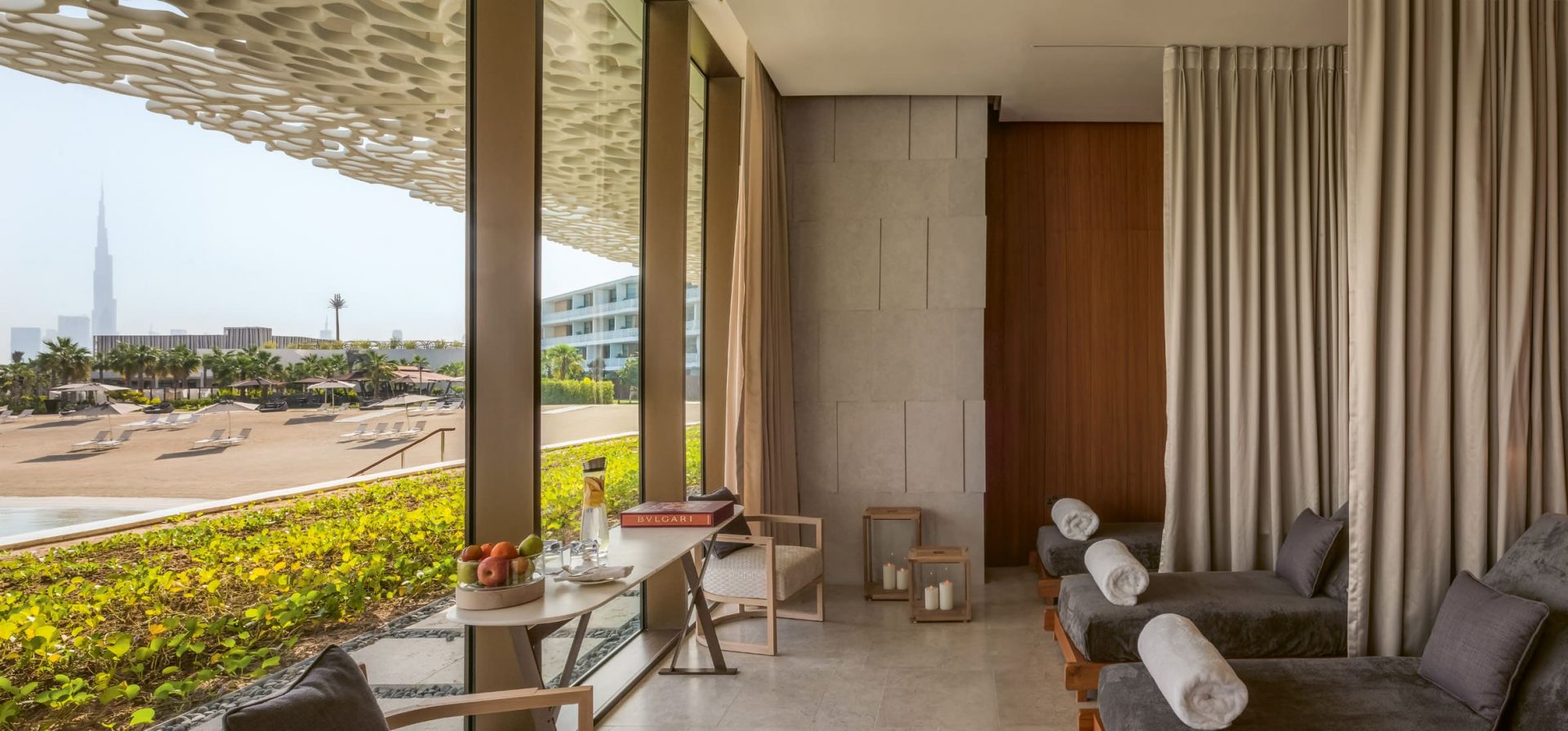 outdoor scene with lounge chairs and view of dubai skyline