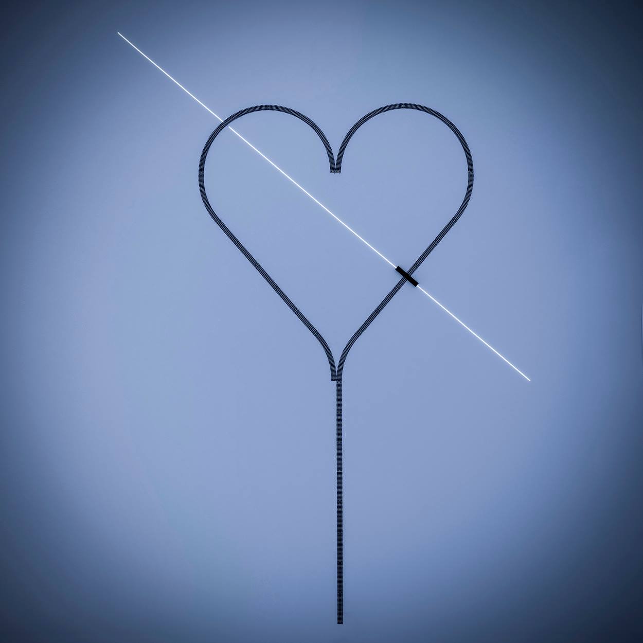 blue background with black heart outline with ray of light striking through horizontally