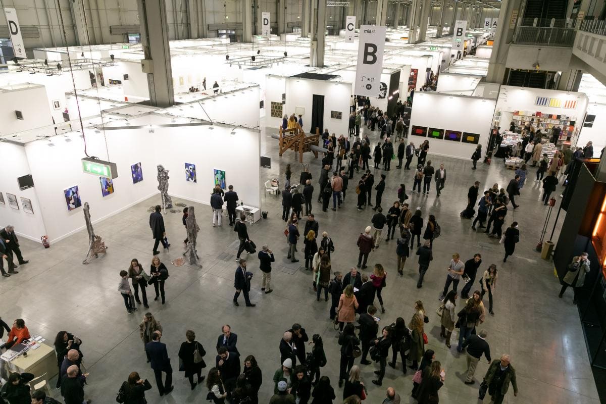 view of miart 2019 art fair from above showing people walking in the galleries