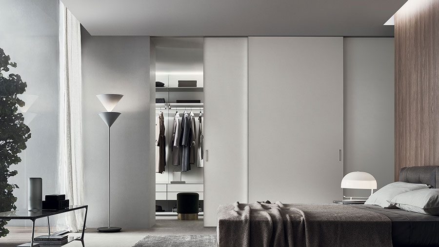 sliding doors as a partition between bedroom and dressing room by rimadesio the best italian doors manufacturer