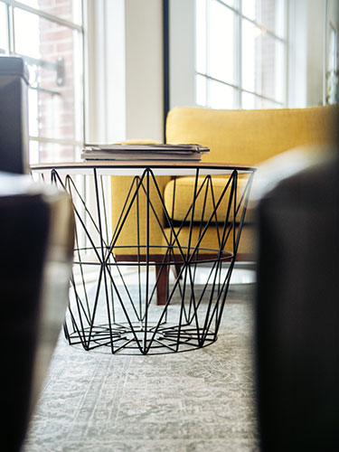 coffe table with metal structure used in a project where the client hire interior designer online