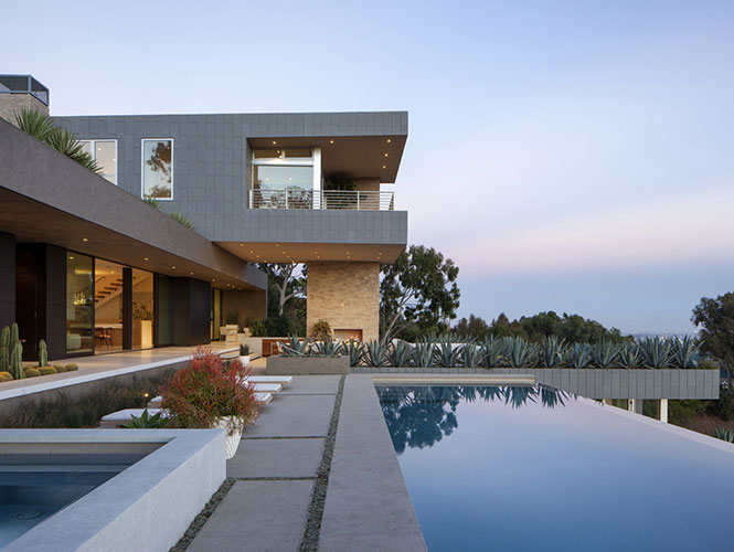 exterior of a villa with a pool designed by a high end interior designers in los angeles