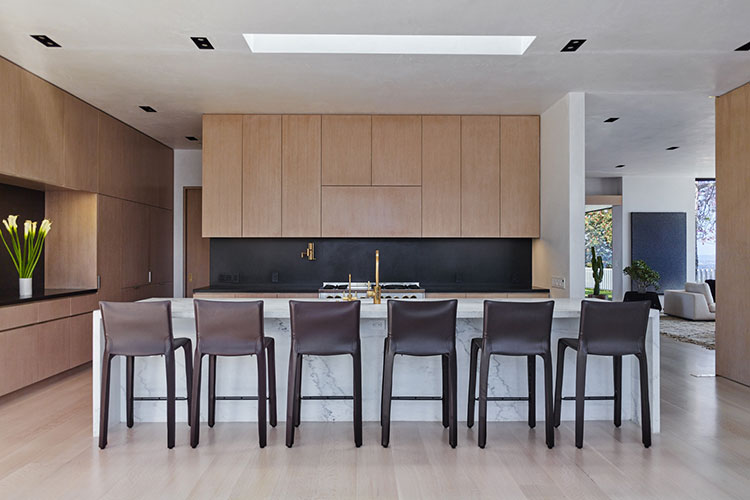 modern kitchen with cab stools by cassina chosen by one of the high end interior designer in los angeles