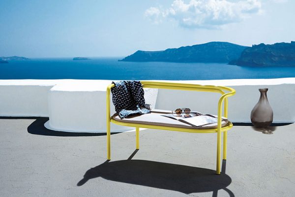 locus solus loveseat by exteta on a terrace with a seaview