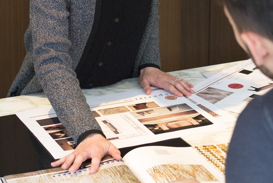 Italian interior designers working on armani dada kitchen project in their atelier when they were hired for an interior design online assignment