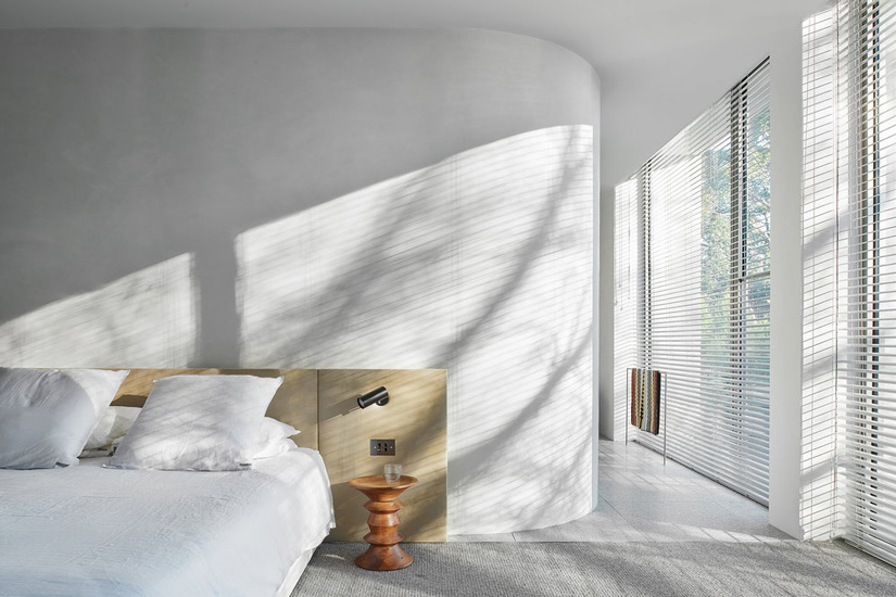 Minimal design and neutral palette for this bedroom designed by Davidov Architects in Melbourne