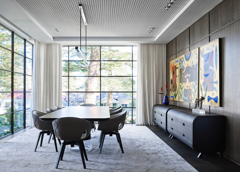 Australian Artwork and Ginger Chairs by Roberto Lazzeroni for Poltrona Frau for this fusion style Dining room designed by Decus Interiors, one of the best interior designers Sydney has to offer