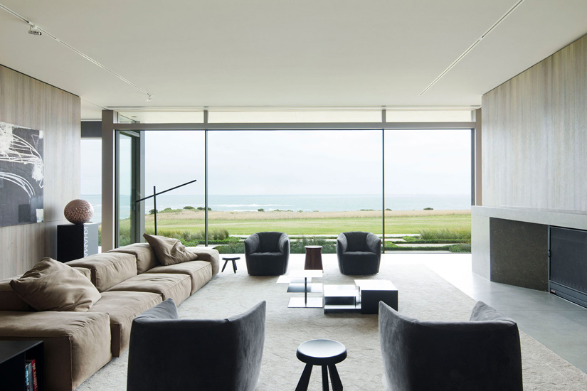 Minimalist Living Room with an amazing view on the ocean. Interior design by Carr, one of the best interior designers Melbourne has to offer