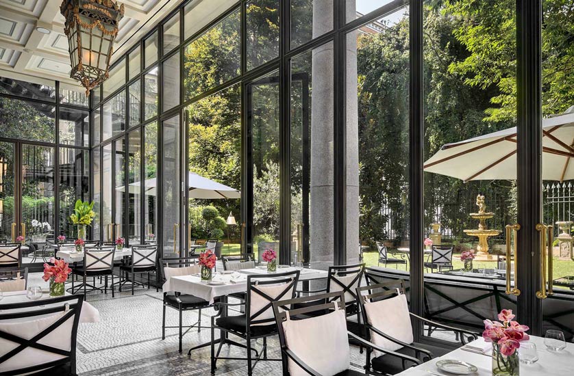 An enchanting garden room at Palazzo Parigi Hotel & Grand Spa, one of most precious hotel in our list of the best five stars hotels in milan.