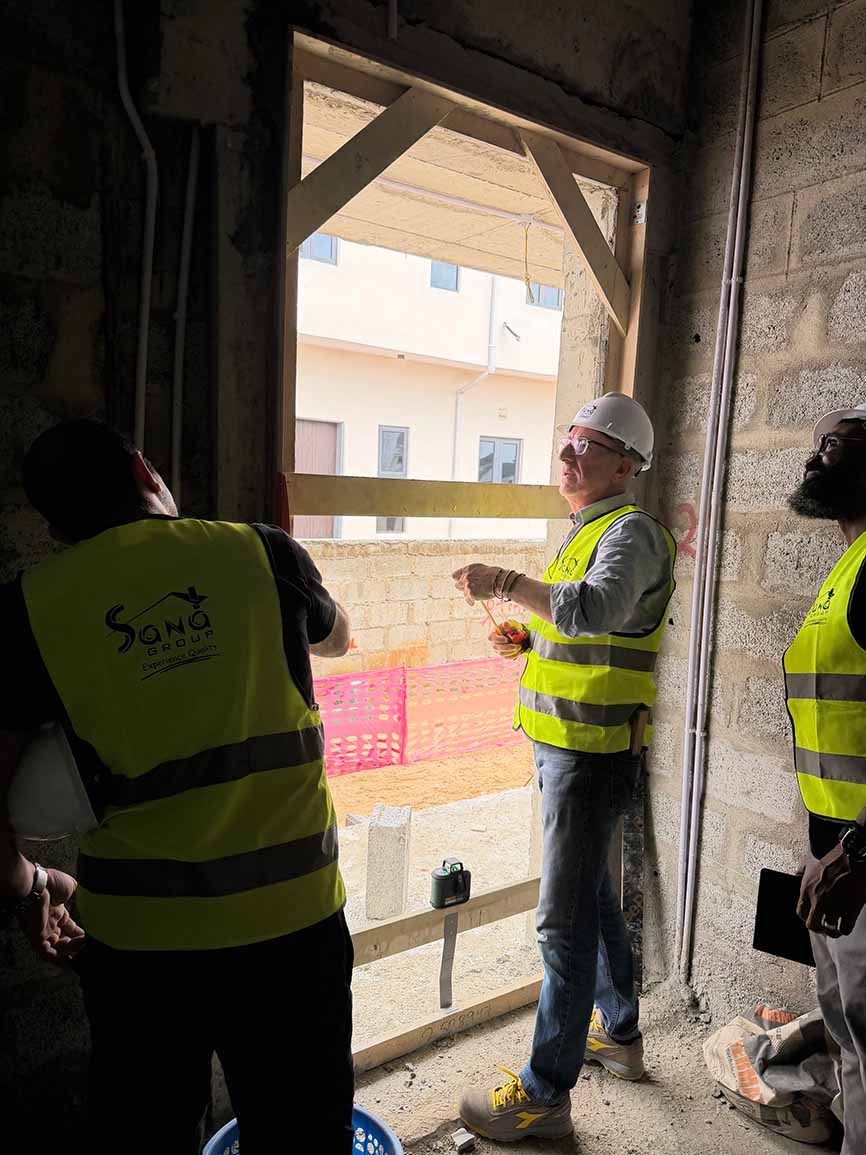 People measuring the openings on site for the villa interior design in Lagos