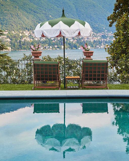 View from the pool looking over lake Como and the exterior furniture
